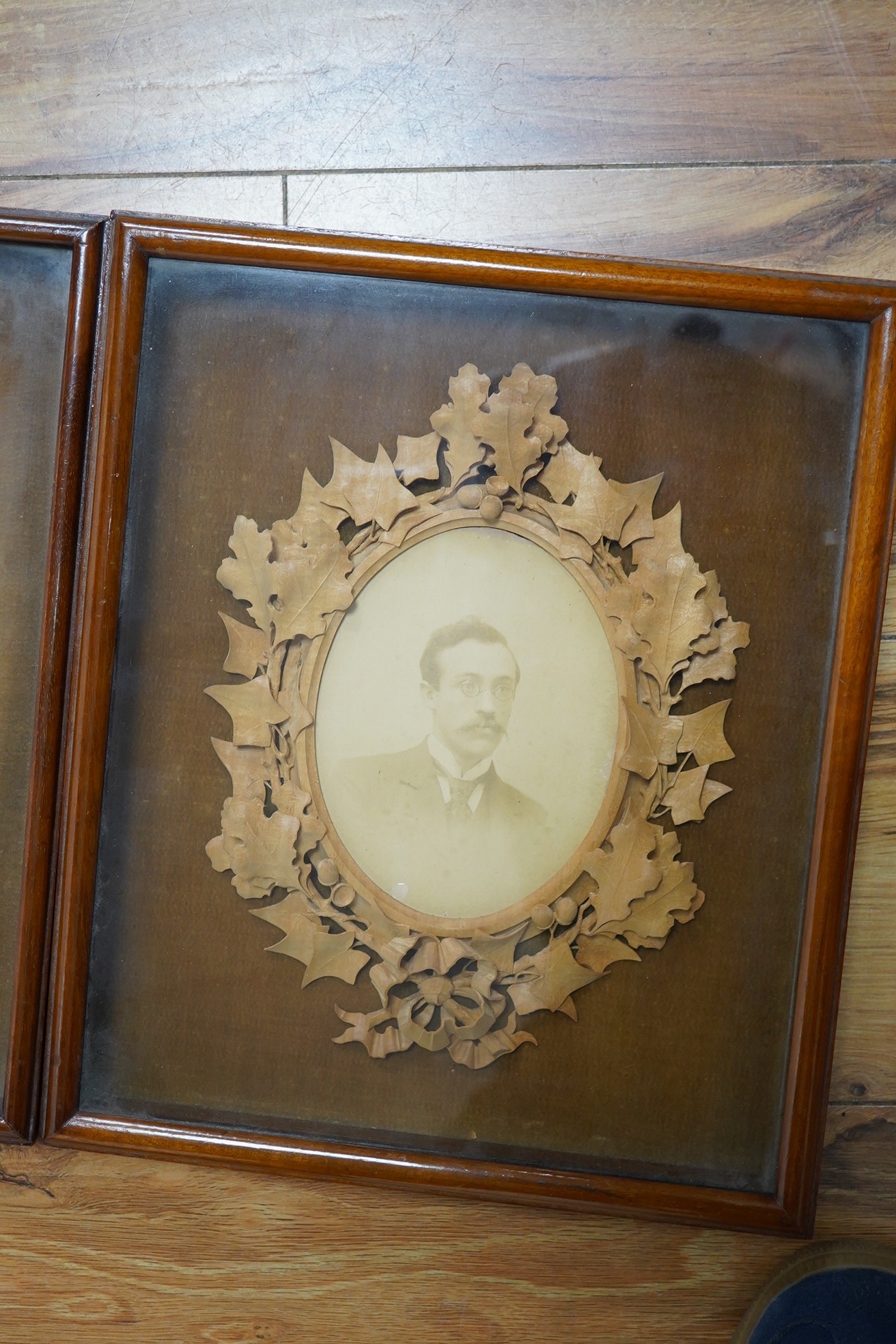 Two photograph frames, finely carved by Alfred Jones, see reverse of both, Margaret Edmondson frame 25cm wide x 30cm high. Condition - good